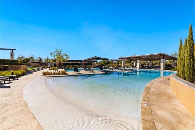 view of pool featuring a patio