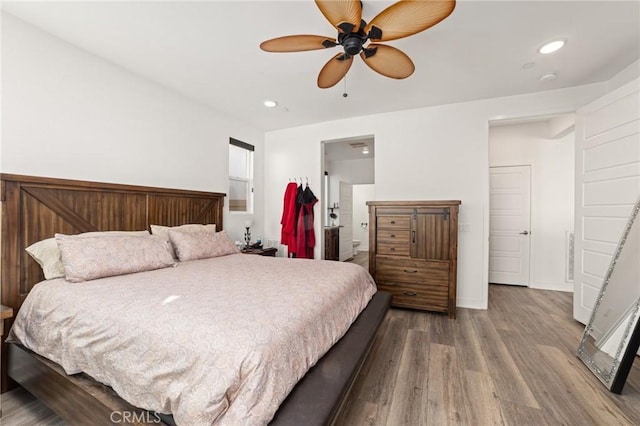 bedroom featuring hardwood / wood-style flooring and ceiling fan