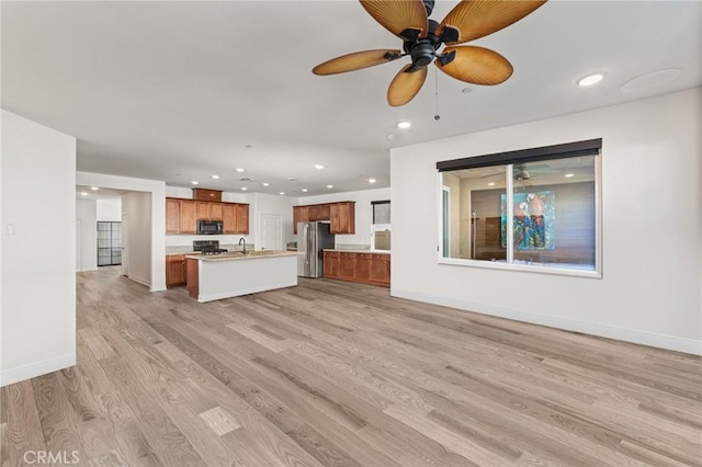 unfurnished living room featuring light wood-type flooring