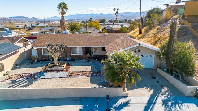 birds eye view of property featuring a mountain view