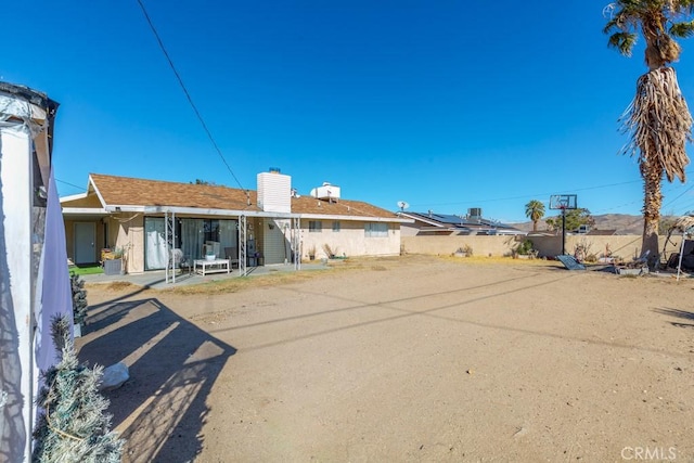 back of property with a patio area