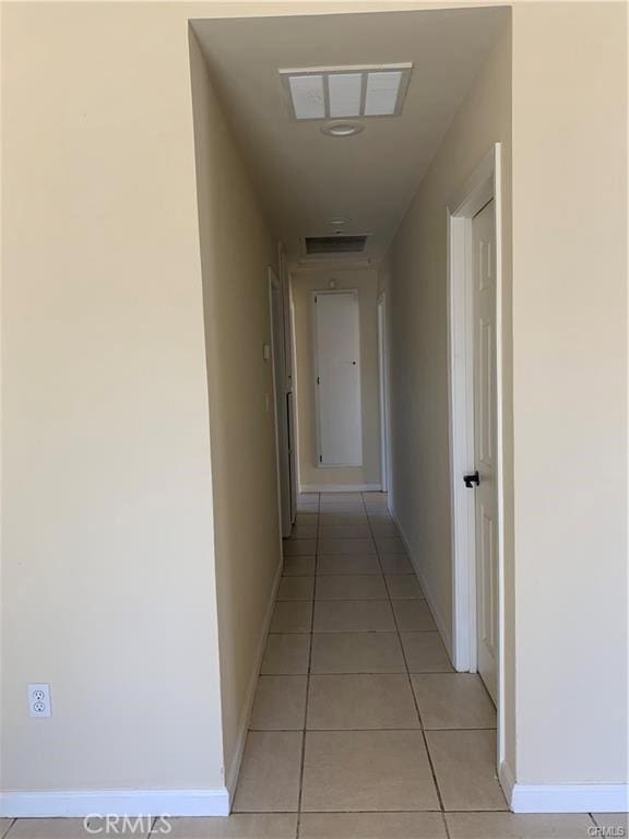 hallway with light tile patterned floors