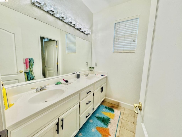 bathroom with tile patterned flooring and vanity