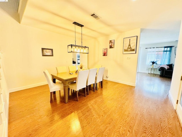 dining area with light hardwood / wood-style floors