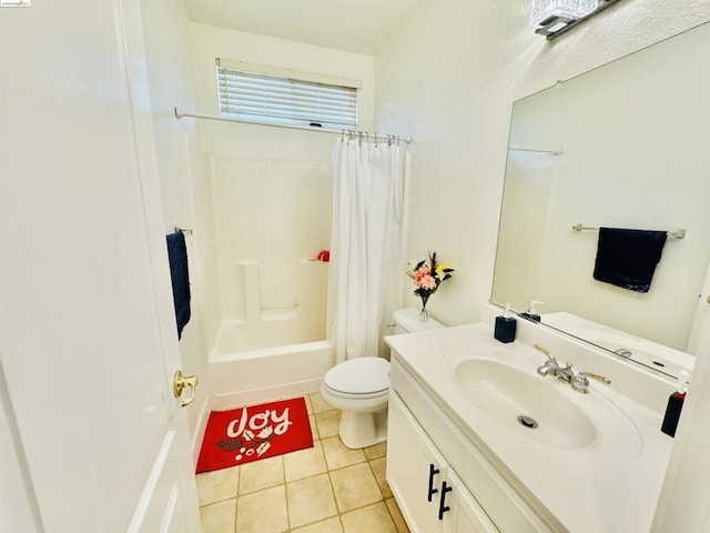 full bathroom featuring tile patterned flooring, shower / tub combo, vanity, and toilet