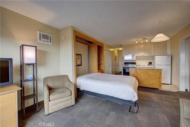 carpeted bedroom with white fridge