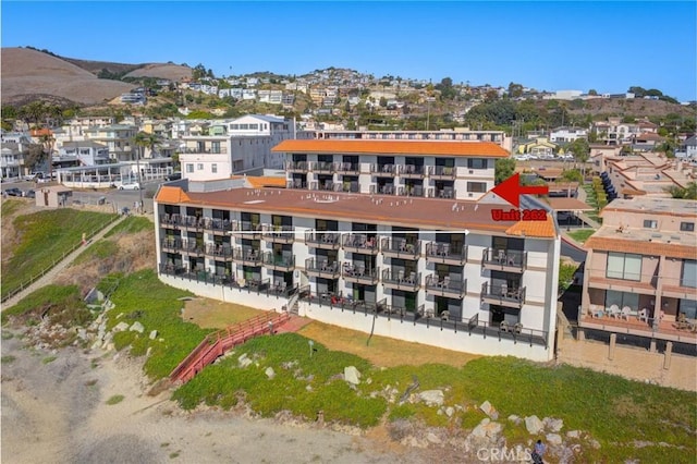 birds eye view of property with a mountain view