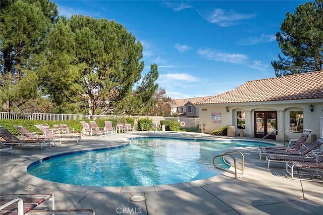 view of swimming pool with a patio