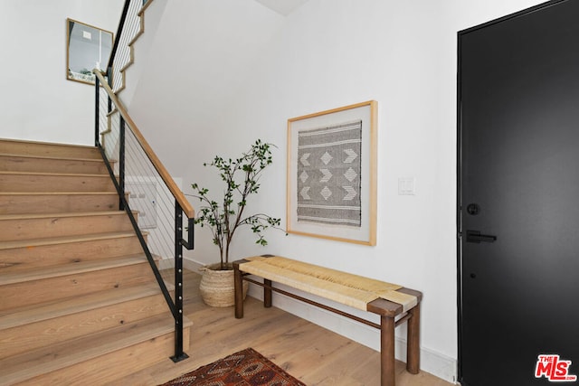 staircase featuring hardwood / wood-style flooring