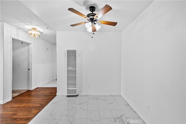 empty room featuring light hardwood / wood-style flooring and ceiling fan