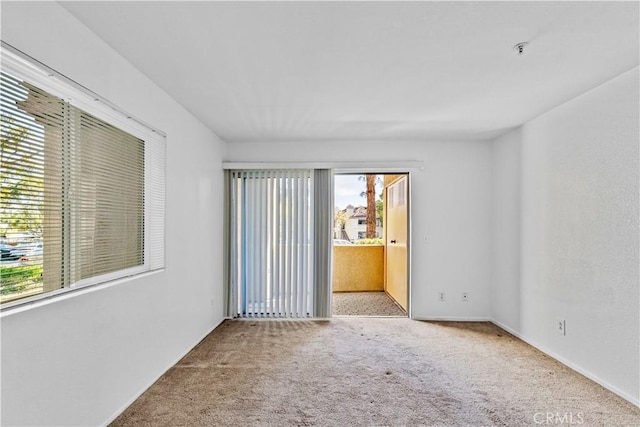 empty room featuring light colored carpet