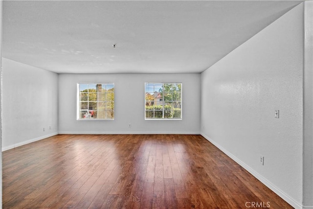 unfurnished room featuring hardwood / wood-style floors