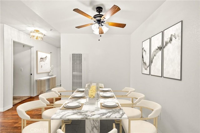 dining area featuring hardwood / wood-style flooring and ceiling fan