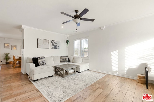 living room with light hardwood / wood-style floors, ceiling fan, and ornamental molding