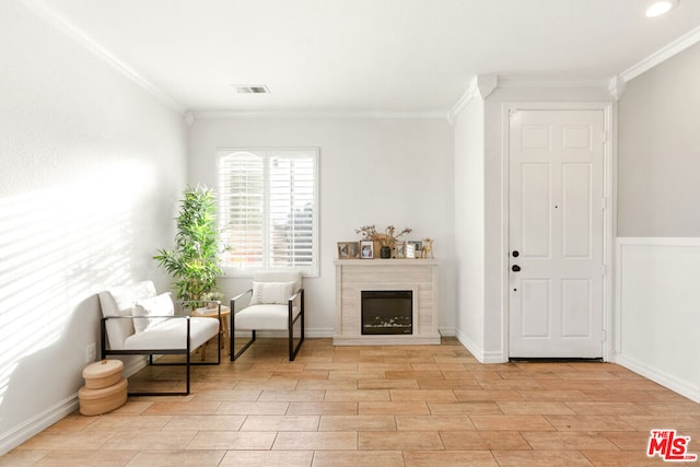 sitting room with ornamental molding