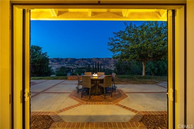 view of patio / terrace featuring a mountain view