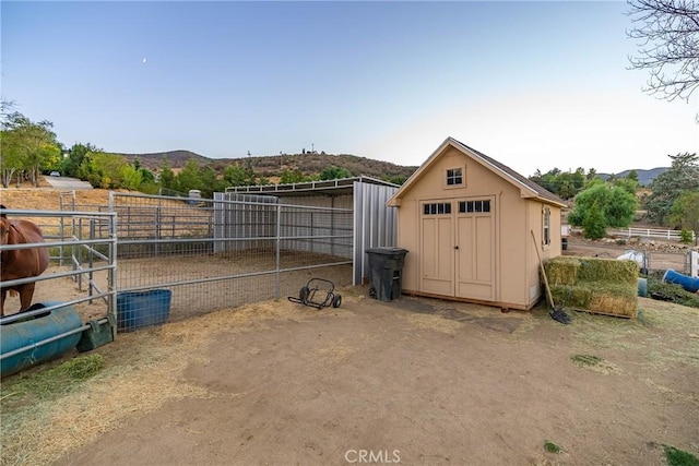 view of outbuilding with a mountain view