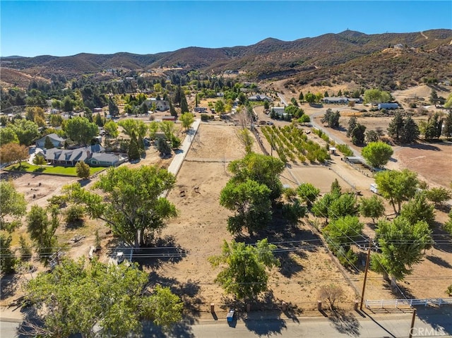 birds eye view of property with a mountain view