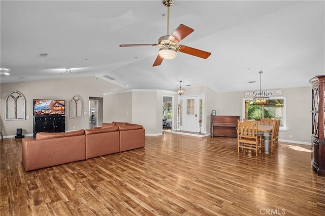 living room featuring hardwood / wood-style floors, ceiling fan, and vaulted ceiling