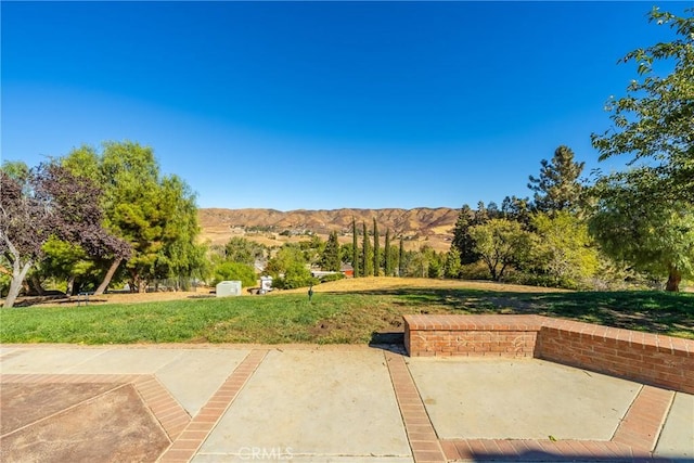 view of patio / terrace featuring a mountain view