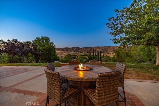 view of patio / terrace with a mountain view