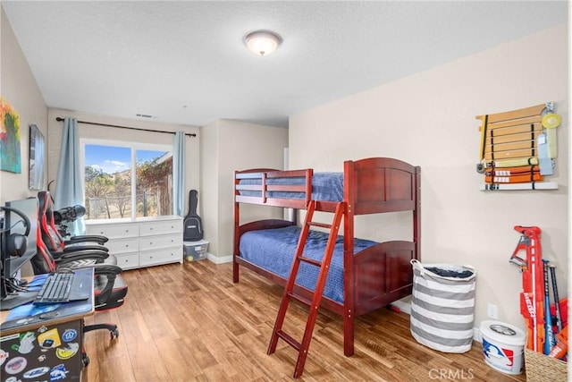 bedroom featuring wood-type flooring