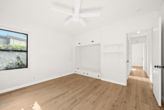 unfurnished bedroom featuring light hardwood / wood-style flooring, a closet, and ceiling fan