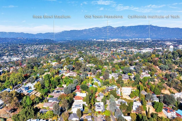 birds eye view of property with a mountain view