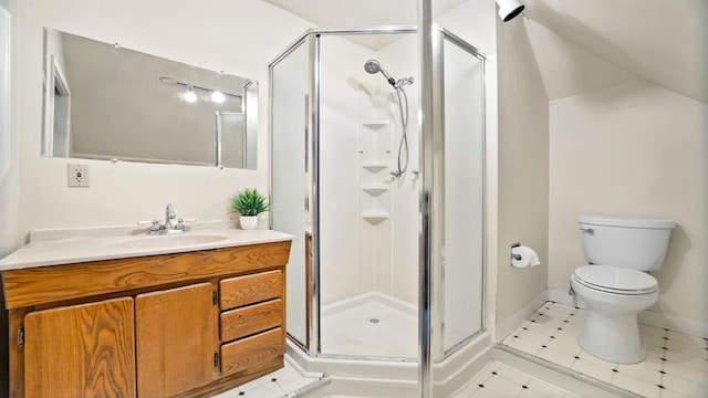 bathroom featuring tile patterned floors, toilet, vanity, and walk in shower