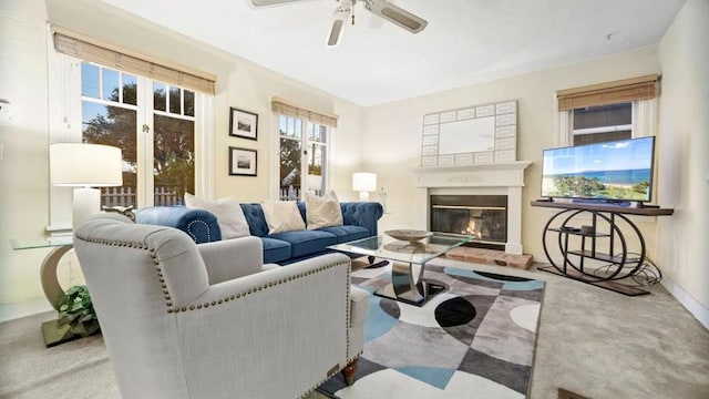 living room with ceiling fan and light carpet