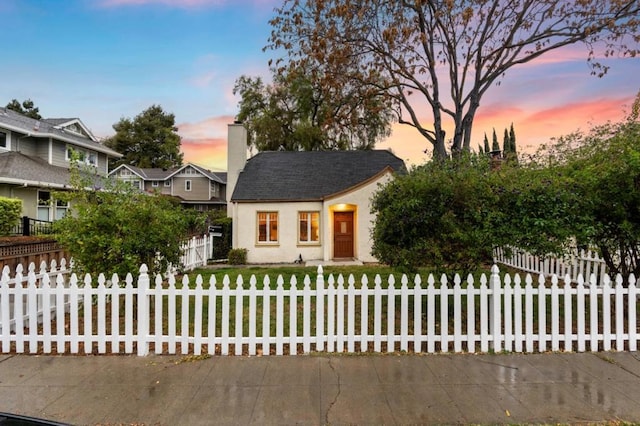 view of front of home with a yard