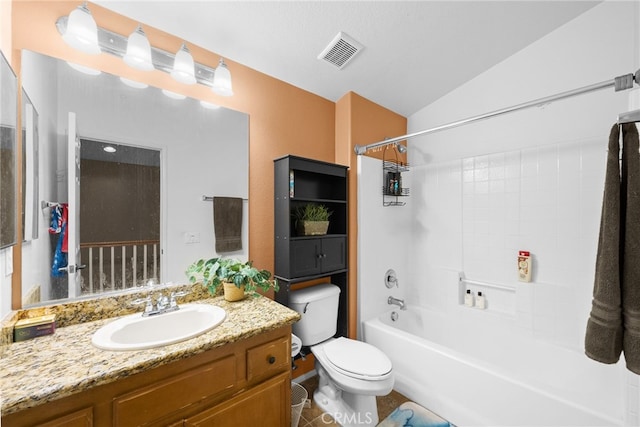 full bathroom featuring vanity,  shower combination, lofted ceiling, tile patterned floors, and toilet