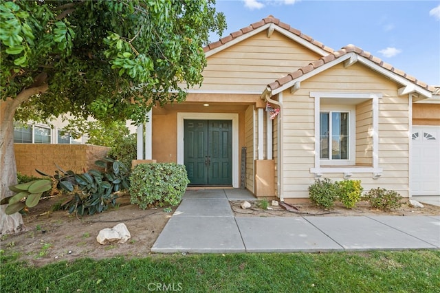 view of exterior entry featuring a garage