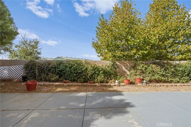 24809 Melrose Dr, Menifee, CA 92585 - view of patio featuring a fenced backyard