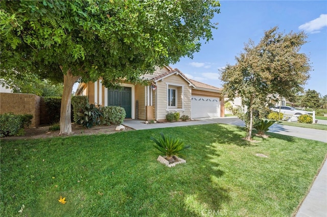 view of front of home with a front yard and a garage