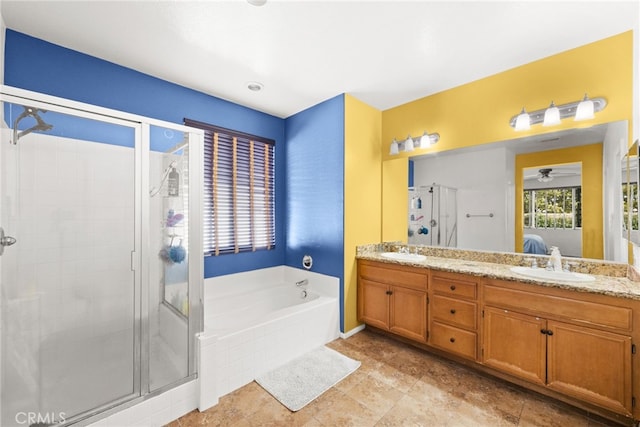 bathroom featuring plus walk in shower and vanity