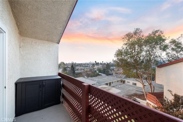 view of balcony at dusk