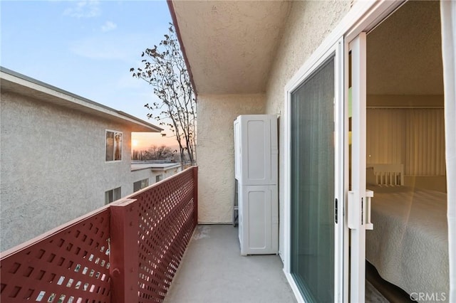 view of balcony at dusk