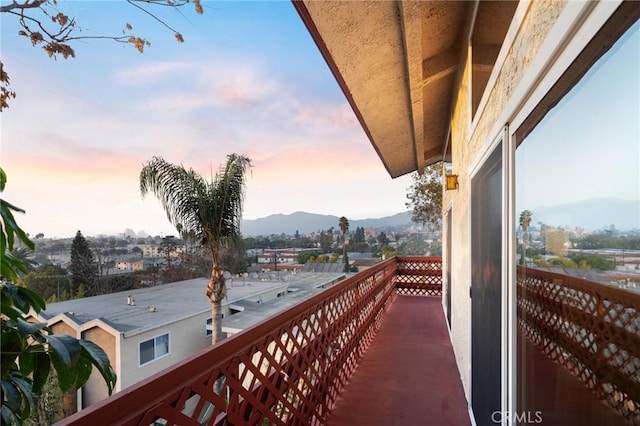 balcony at dusk with a mountain view