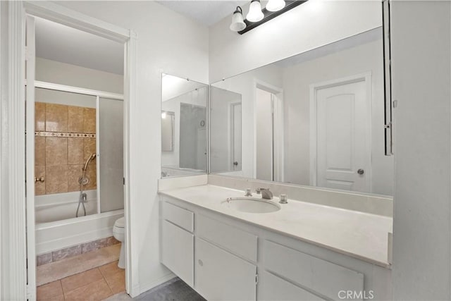 full bathroom featuring toilet, tile patterned floors, vanity, and shower / bathing tub combination