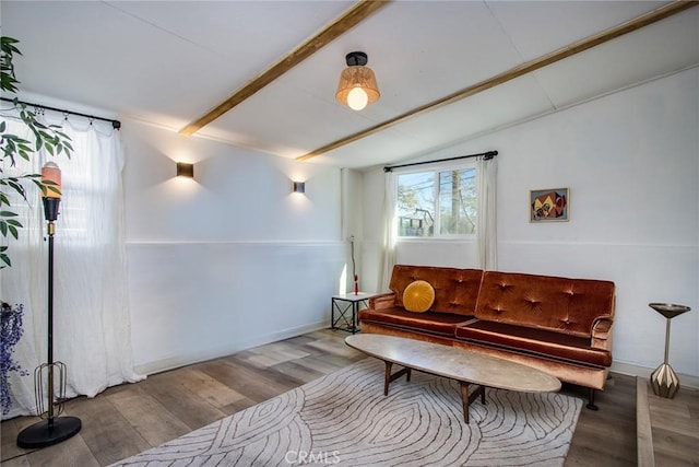 sitting room with vaulted ceiling with beams and wood-type flooring