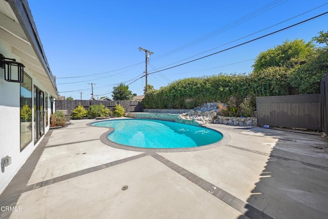 view of pool featuring a patio