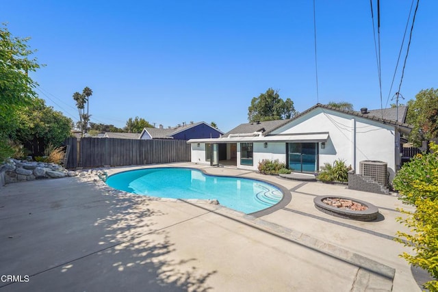 view of pool featuring a patio area and central AC