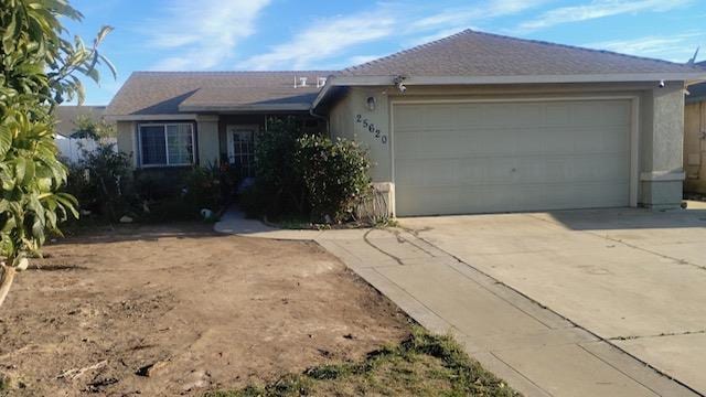 ranch-style house featuring a garage