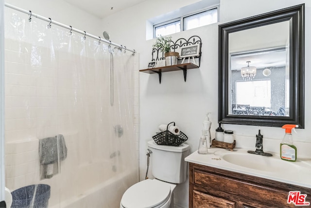 full bathroom featuring shower / tub combo with curtain, vanity, and toilet