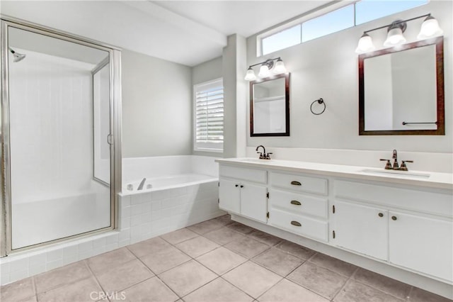 bathroom featuring tile patterned floors, vanity, and shower with separate bathtub