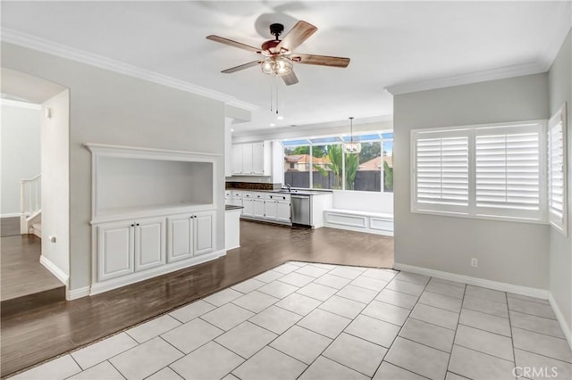 unfurnished living room with crown molding, ceiling fan, and light hardwood / wood-style floors