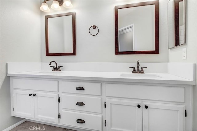 bathroom with vanity and tile patterned floors