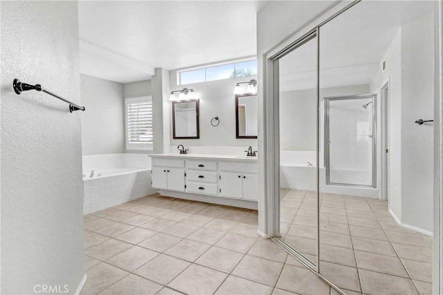 bathroom featuring tile patterned flooring, vanity, and independent shower and bath