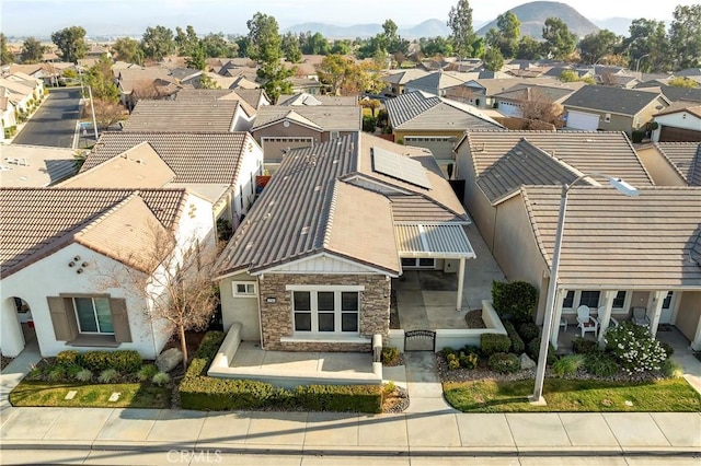 birds eye view of property with a mountain view